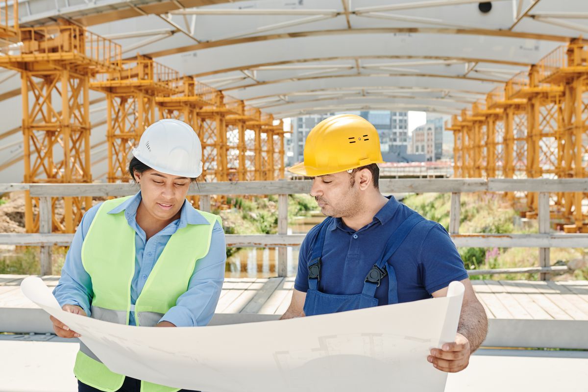 Construction and refurbishment professionals reviewing building plans